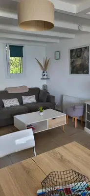 a living room with a couch and a table at APT 2 chambres vue exceptionnelle in Tiuccia