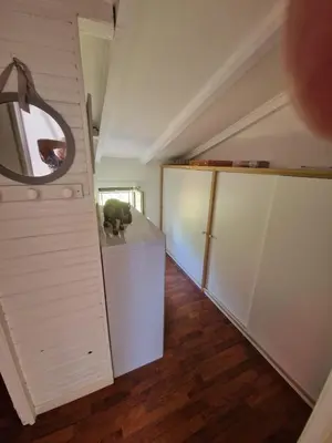 a room with a white closet and a mirror at APT 2 chambres vue exceptionnelle in Tiuccia
