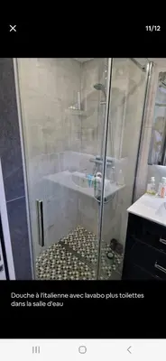 a shower with a glass door in a bathroom at APT 2 chambres vue exceptionnelle in Tiuccia