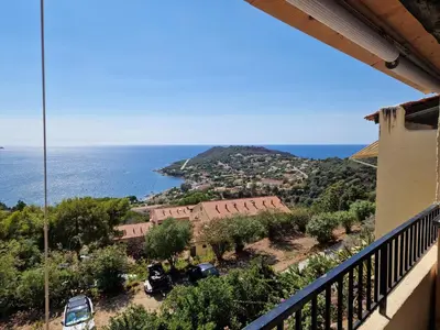 a view of the ocean from the balcony of a house at APT 2 chambres vue exceptionnelle in Tiuccia