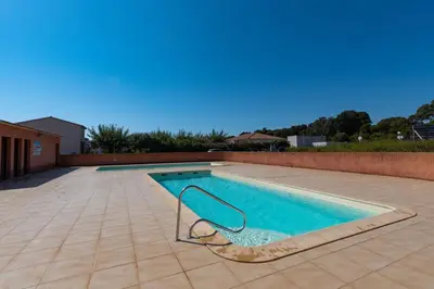 a swimming pool with a slide in the middle at Jaso - Maison à 5min de la plage in Cervione