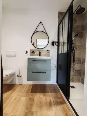 a bathroom with a sink and a mirror at Gîte casa di l'Apa in Venaco