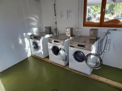 three washing machines and a washer and dryer in a room at U Sole Livante mini villa vue mer Santa Giulia in Porto-Vecchio