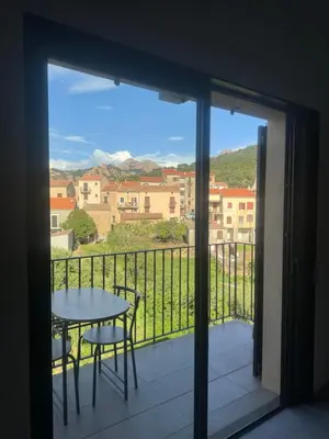 a view of a balcony with a table and chairs at T3 de standing à Piana in Piana