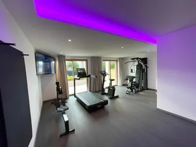 a room with a gym with a purple ceiling at Novaya Suites in Ajaccio