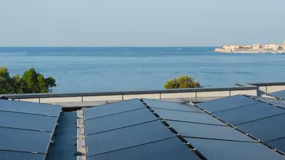 a view of the ocean from the roof of a building at Novaya Suites in Ajaccio