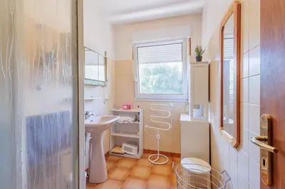 a small bathroom with a sink and a window at Maison du Fangu - Da Simone - Maison de 160 m2 in Galeria