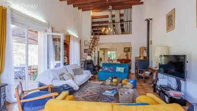 a living room with a couch and a tv at Maison du Fangu - Da Simone - Maison de 160 m2 in Galeria