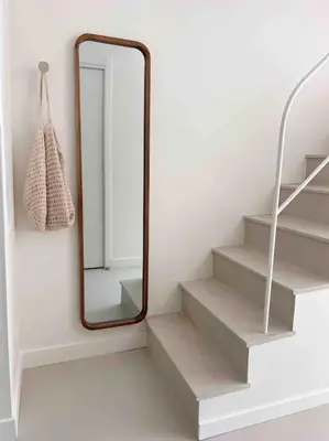 a mirror on a wall next to some stairs at LA GRANDE JANE petite villa bord de mer in Borgo