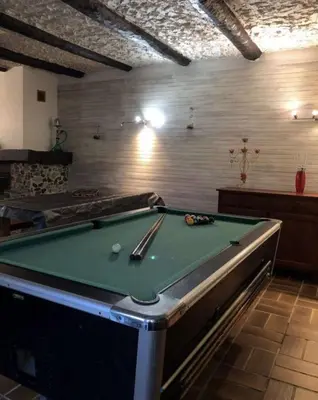 a room with a pool table in a room at Location Estivale en Haute Corse in Scata
