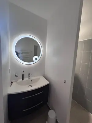 a bathroom with a sink and a mirror at Villa élégante piscine privée Palombaggia Porto-vecchio in Porto-Vecchio