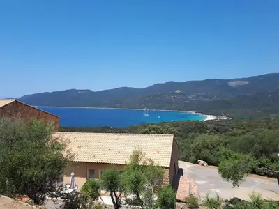 a house with a view of a lake at Mini villa 70 - piscine chauffée in Serra-di-Ferro