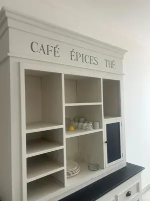 a white cabinet with the words cafe buisers sqor at T2 vue mer à 8 min du centre ville d'Ajaccio et 1 min des plages in Ajaccio