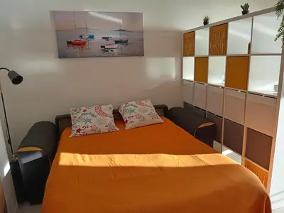 a bedroom with a bed with two pillows on it at Studio vue mer bord de plage in San-Nicolao