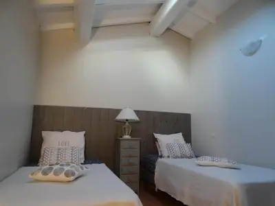 two beds sitting next to each other in a room at Les Voutes in Propriano