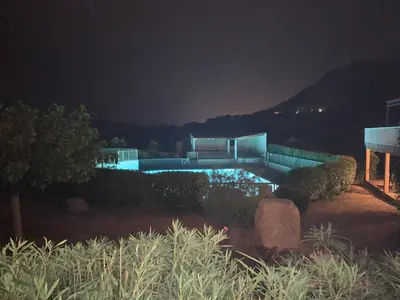 a house with a swimming pool at night at Résidence Santa Giulia Park 1 avec piscine à proximité des plages in Porto-Vecchio