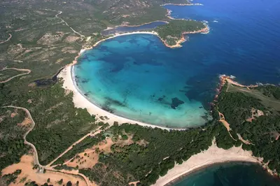 an aerial view of a lake in the ocean at Résidence Les Terrasses de Rondinara in Bonifacio