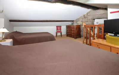 a bedroom with a bed and a tv in a room at Stunning Apartment In Ciamannacce in Ciamannacce