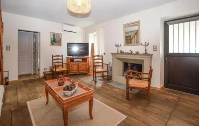 a living room with a fireplace and a tv at Stunning Apartment In Ciamannacce in Ciamannacce