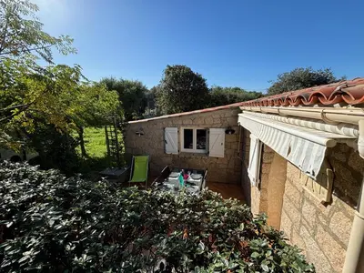 a view of a house with a yard at Caseddu jardin et mer in Viggianello