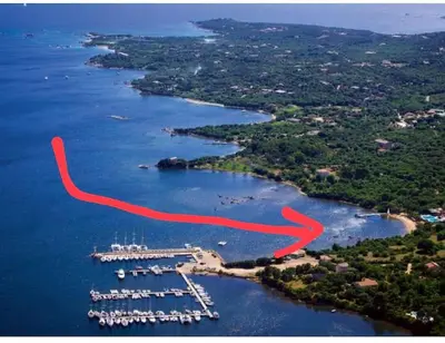 an aerial view of a marina with a red line at Appart 70m2 avec loggia, piscine à débordement vue mer in Pianottoli-Caldarello