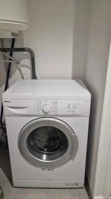 a washer and dryer in the corner of a room at Casa Ghjulia 4 étoiles à Porto-Vecchio centre-ville in Porto-Vecchio