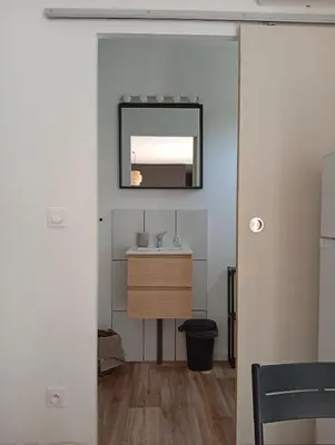 a bathroom with a sink and a mirror on the wall at Résidence A Casetta in Monacia-dʼAullène