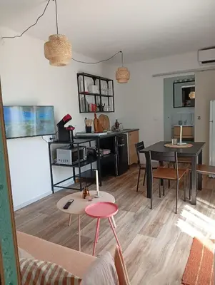 a living room with a couch and a table at Résidence A Casetta in Monacia-dʼAullène