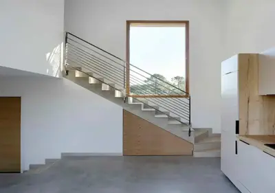 a staircase in a white room with a window at Villa d'architecte in Sotta