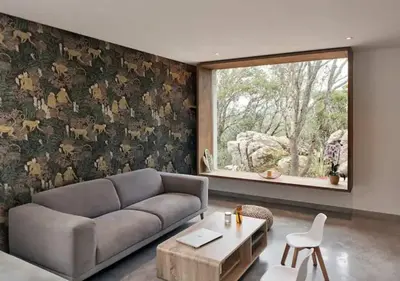 a living room with a couch and a window at Villa d'architecte in Sotta