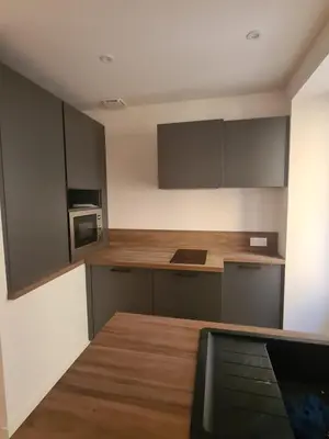 a kitchen with a counter top and a microwave at T2 centre ville Ajaccio in Ajaccio