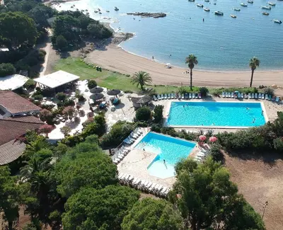 an aerial view of a resort with a pool and a beach at Village Naturiste La Chiappa in Porto-Vecchio
