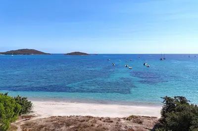 a group of people swimming in the ocean at Villa San Ciprianu Mare Di Lecci in Lecci