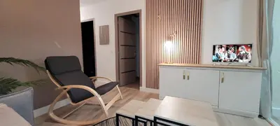a living room with a chair and a table at Doalchaléda in Linguizzetta