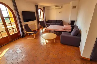 a living room with a couch and a table at T4 Furesta - Casa Mattea in Aléria