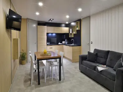 a living room with a table and a couch at Group Stay near Sea in Propriano in Propriano