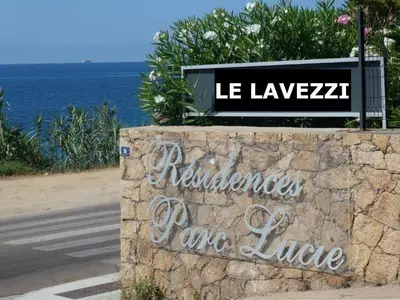 a sign on a wall next to the ocean at Ajaccio Sanguinaires T3 proche Trottel et 150m de la mer, belle résidence in Ajaccio
