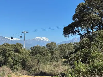 a ski lift with snow capped mountains in the background at Ajaccio Sanguinaires T3 proche Trottel et 150m de la mer, belle résidence in Ajaccio