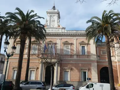 a building with a clock tower on top of it at Ajaccio Sanguinaires T3 proche Trottel et 150m de la mer, belle résidence in Ajaccio