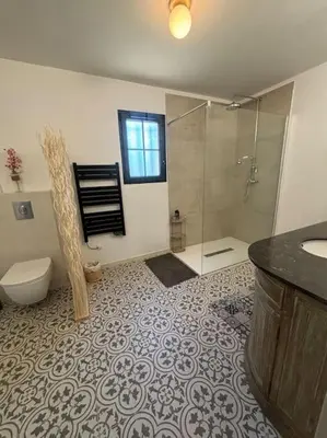 a bathroom with a shower and a toilet and a sink at Casa Nostra in Olmeto