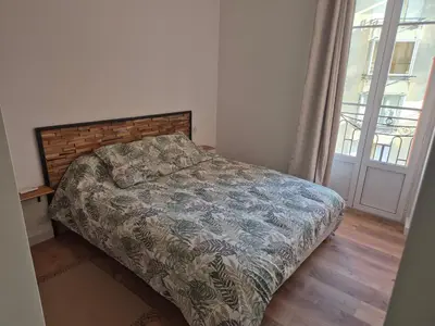 a bedroom with a bed and a window at Trottel a Livia in Ajaccio