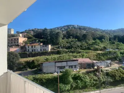 a view of a small town with a hill at Appartement F4 pour 6 personnes in Ajaccio
