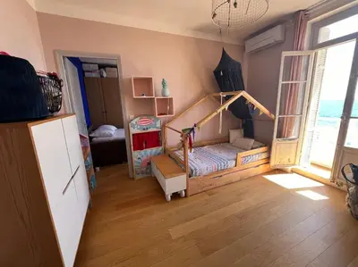 a bedroom with a bunk bed in a room at T4 Pieds dans l'eau ! in Ajaccio