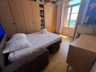 a bedroom with a bed with two stuffed animals on it at T4 Pieds dans l'eau ! in Ajaccio