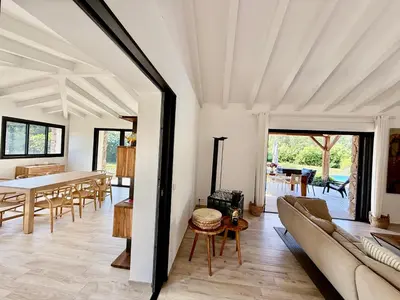a living room with a couch and a table at Villa à Marina di Fiori - 8 pers in Porto-Vecchio