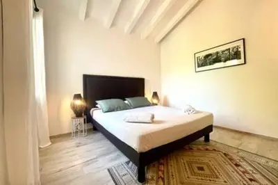 a bedroom with a large bed in a room at Villa à Marina di Fiori - 8 pers in Porto-Vecchio