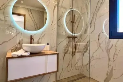 a bathroom with a sink and a mirror at Casa di Macchjerolu - 8 pers in Sotta