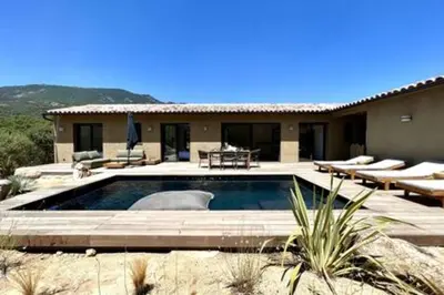 a swimming pool in front of a house at Casa di Macchjerolu - 8 pers in Sotta