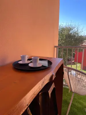 a tray with two coffee cups on a table at Appartement CERICA proche de la plage de Saint Cyprien in Lecci