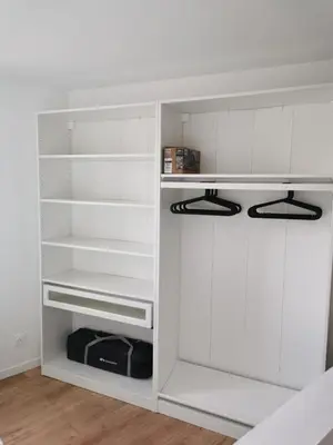 a white closet with white walls and white shelves at Appartement neuf dans hameau proche porto vecchio in Porto-Vecchio